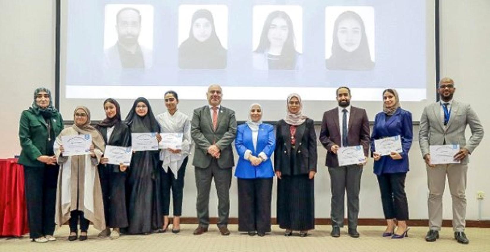 Group photo of the WHO Representative in Bahrain, President of University of Bahrain; and the Dean of the College of Health and Sports Sciences, with the eight winners selected in the WHO competition on “Tackling the misuse and overuse of antibiotics in the Eastern Mediterranean Region.” Photo credit: WHO / WHO Bahrain